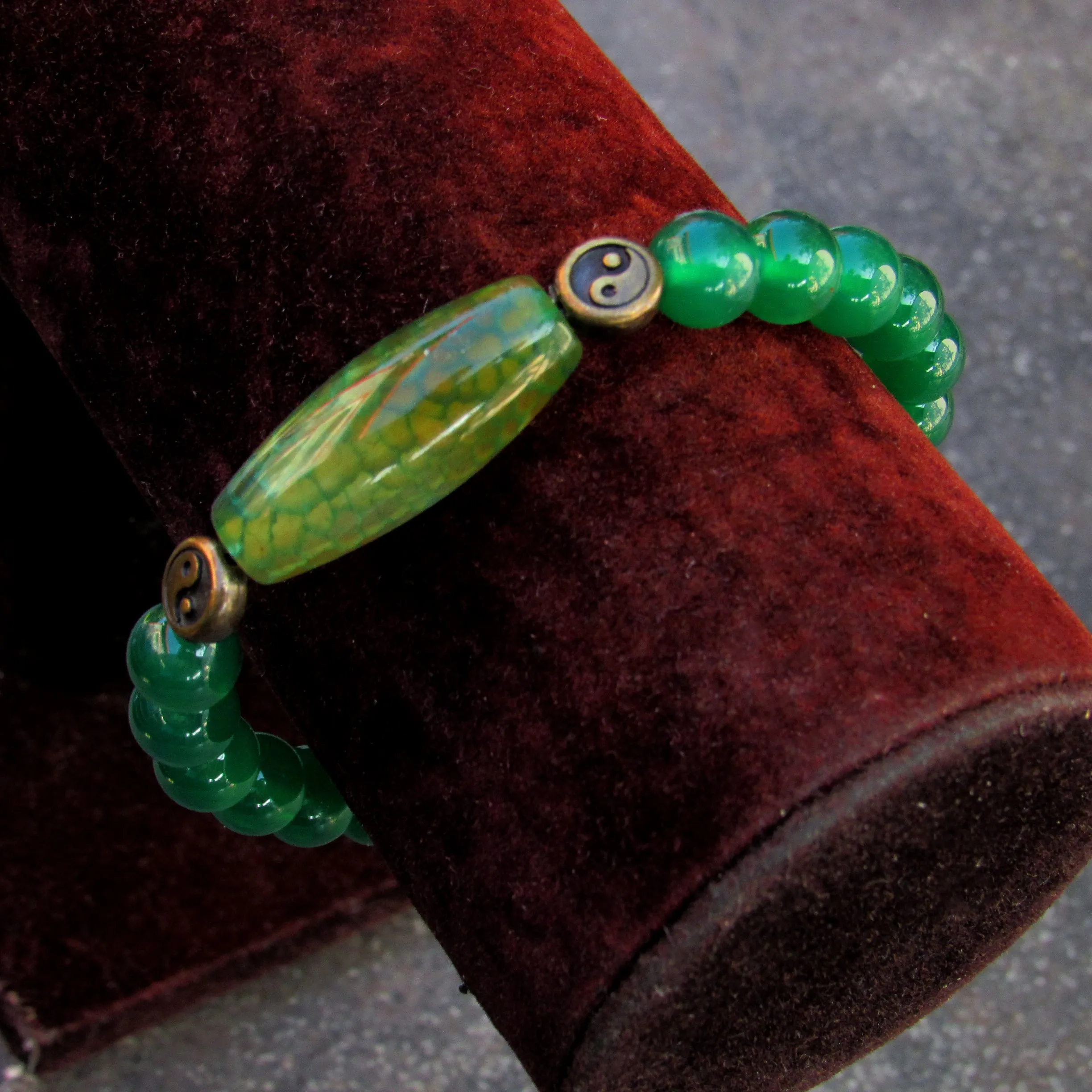 Green onyx gemstone, brass Yin Yang, and Dragon Vein Agate stretch bracelet